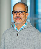 Portrait of Ahmed Ibrahim indoors.