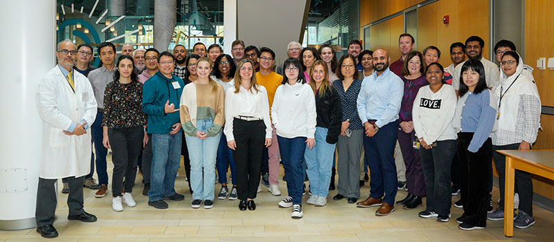Participants in the Tablets and Capsules Short Course pose together in the Ellen H. Yankellow Grand Atrium in Pharmacy Hall.