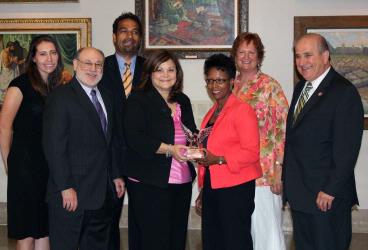 From left: Christine Lee, PharmD, of XLHealth, Raymond Love, PharmD, School of Pharmacy associate dean, James Dowling of McCormick & Co., Magaly Rodriguez de Bittner, PharmD, dean Natalie D. Eddington, PhD, Wendy Cohan of PPS, and Howard Schiff, BSP, of the MPhA.