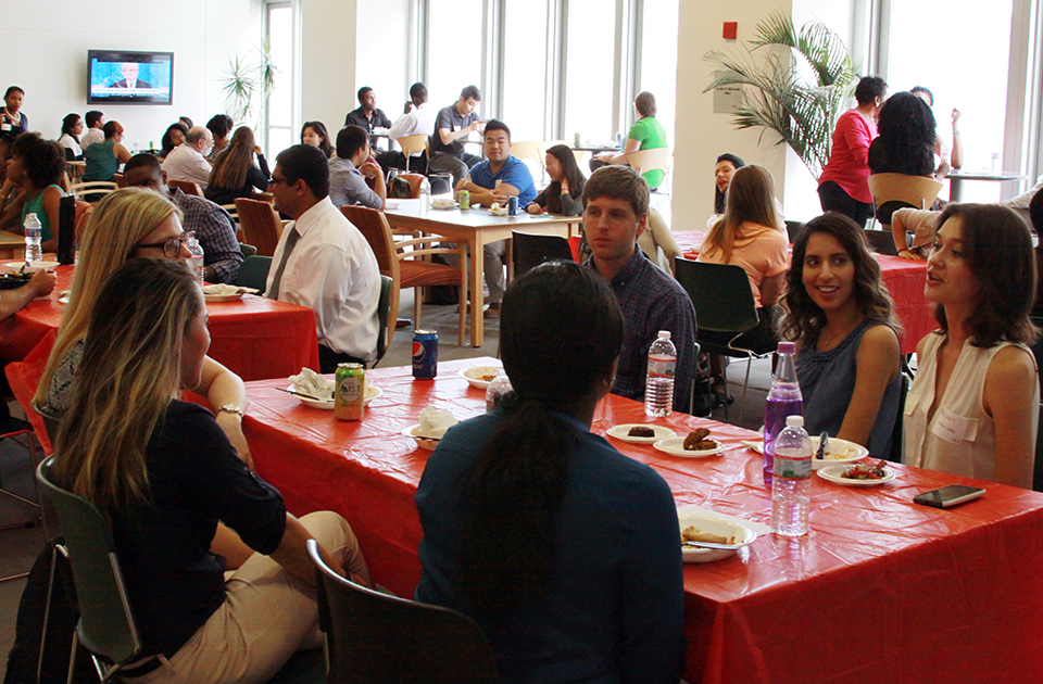 Incoming students mingle during faculty and student luncheon.