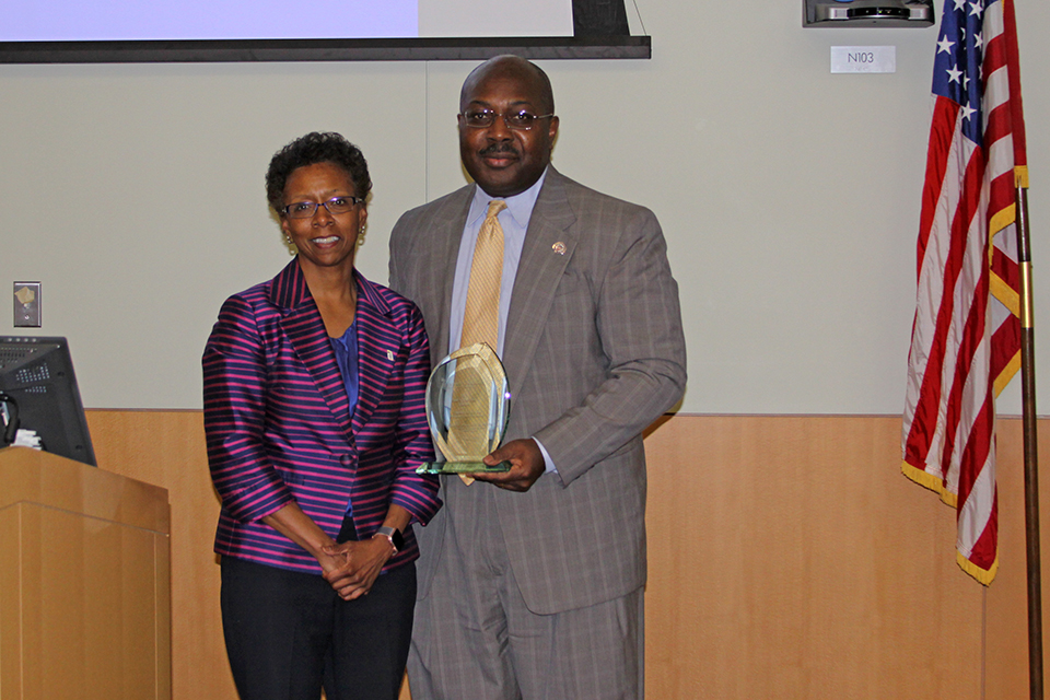 Dean Natalie Eddington Stands to the Left of Dr. Anthony Wutoh