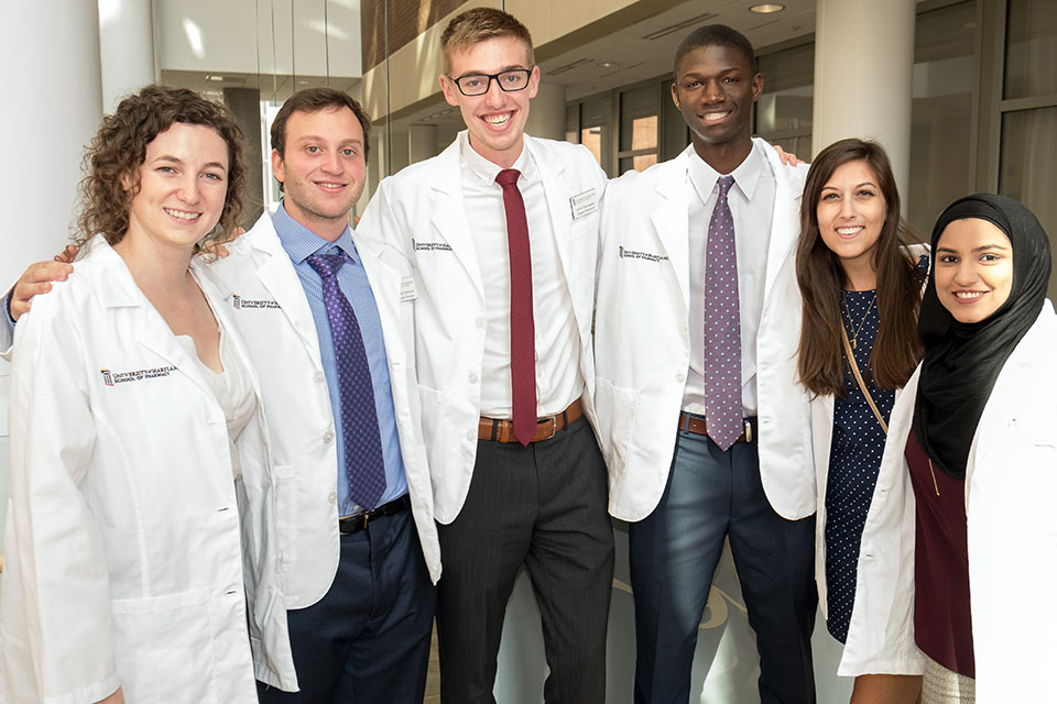 First-year Students Pose for Photo After Receiving White Coats