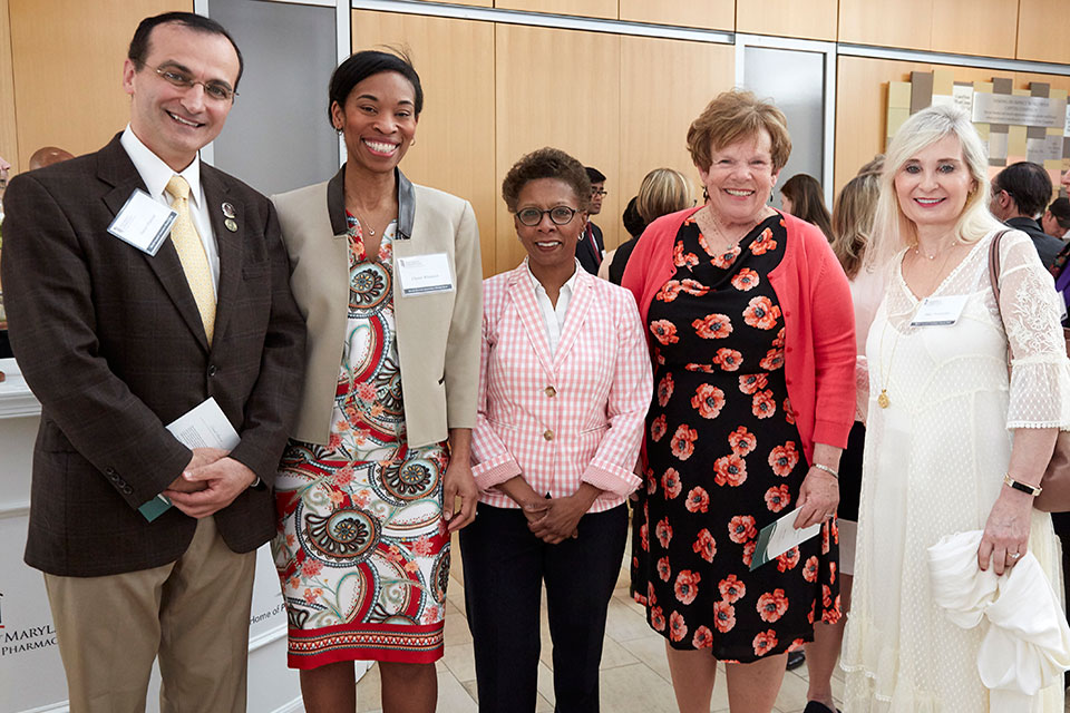 Dean Natalie Eddington poses for photo with Drs. Daniel Mansour, Chanel Whittaker, and Cynthia Boyle.