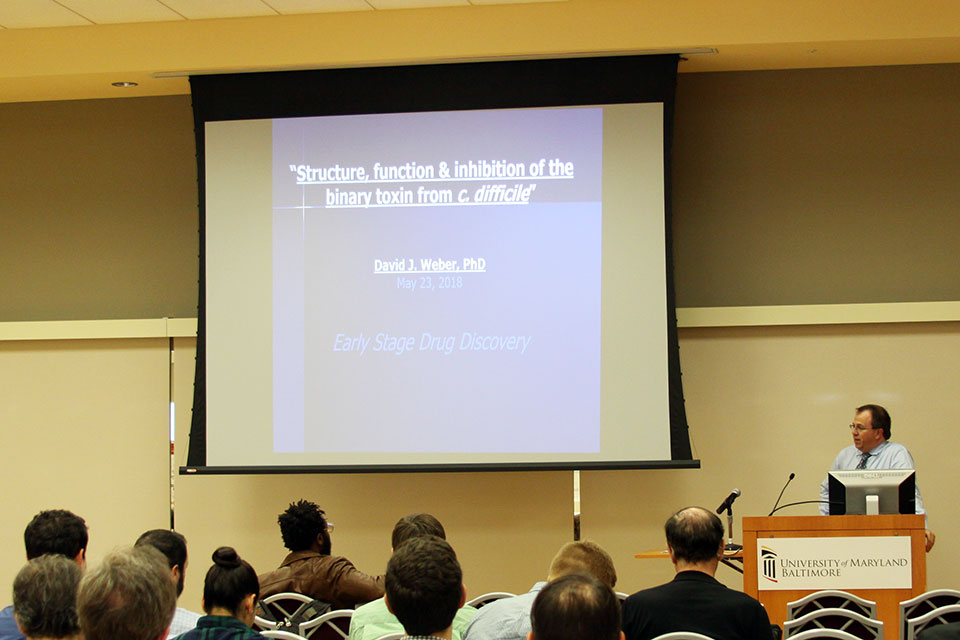 Dr. David Weber delivers a presentation during the CADD Symposium.