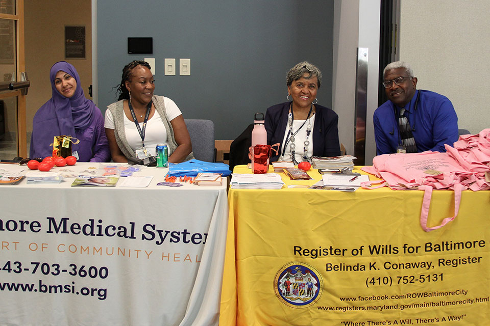 Vendors from the Baltimore Medical System and Register of Wills for Baltimore pose for photo at PATIENTS Day.
