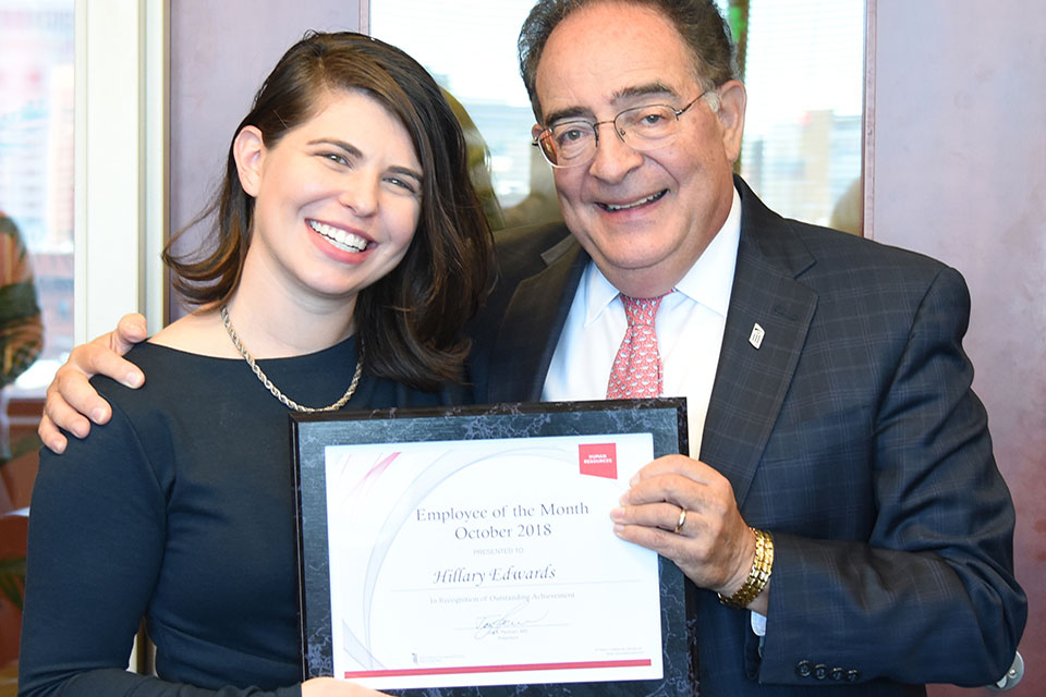 Hillary Edwards, MPH, pictured with UMB President Jay A. Perman, MD.