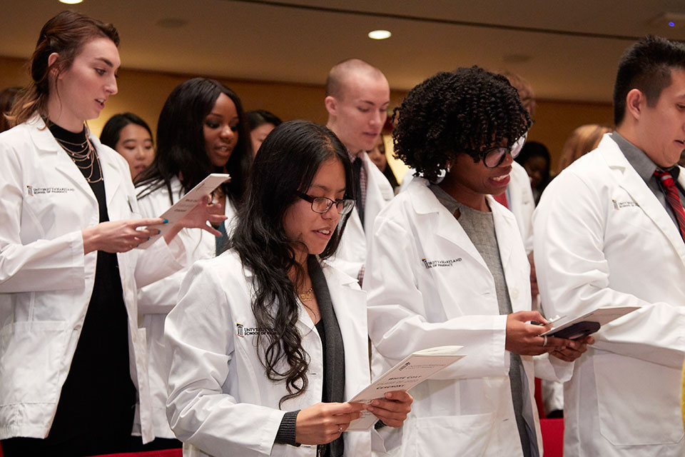 First-year student pharmacists read the Pledge of Professionalism.