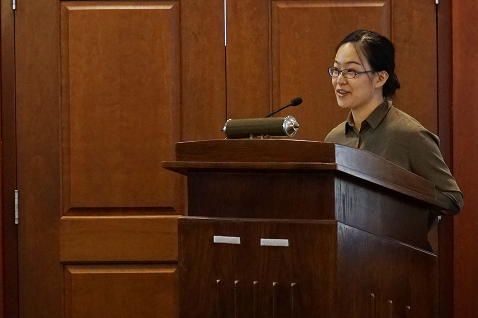 Chengchen Zhang delivers presentation after accepting award.