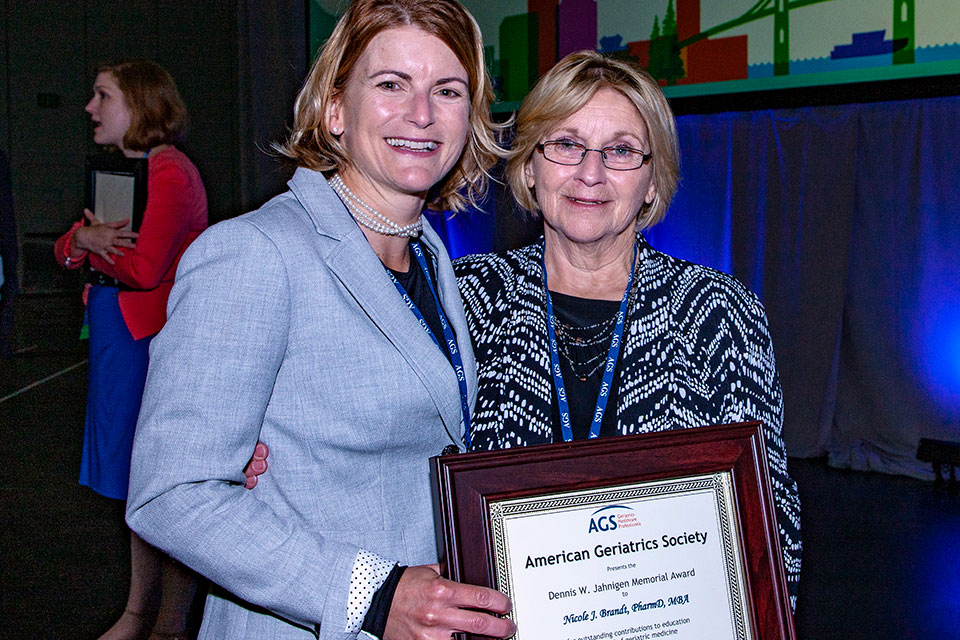 Dr. Nicki Brandt poses for photo with her mother after receiving her award.