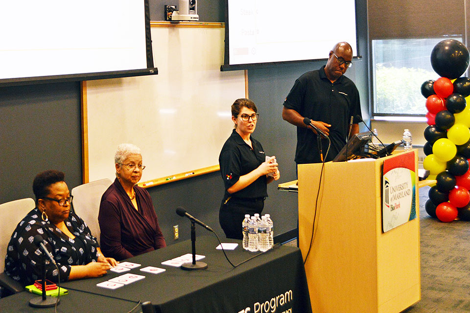 Panelists Del Price and Dwyan Monroe seated next to The PATIENTS Program staff members Hilary Edwards and Rodney Elliott.