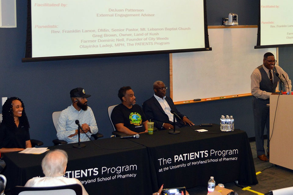 Panelists from the third panel discussion hosted during PATIENTS Day seated next to panel moderator DeJuan Thompson.