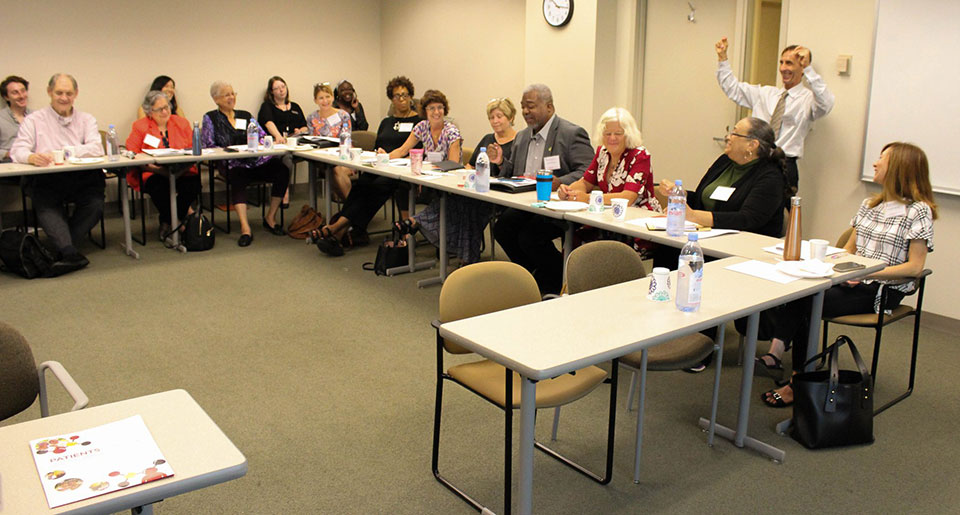 Dr. C. Daniel Mullins speaks to a roundtable of stakeholders during the kick-off meeting for the new grant.