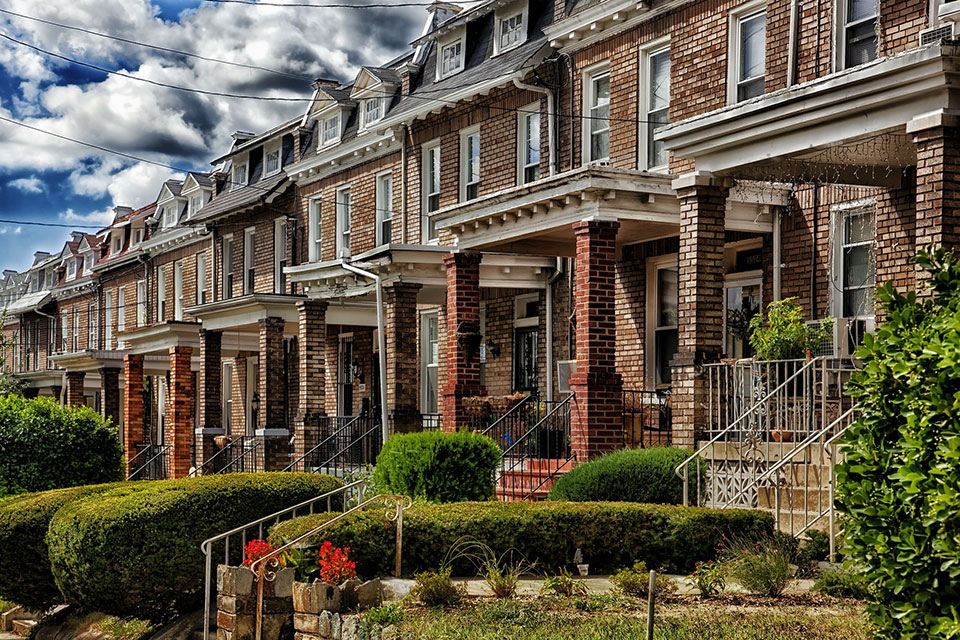 Street lined with rowhomes.