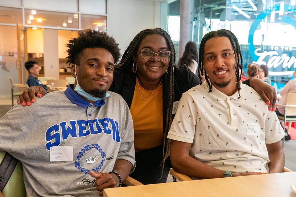 Three students at PharmD welcome day in the atrium