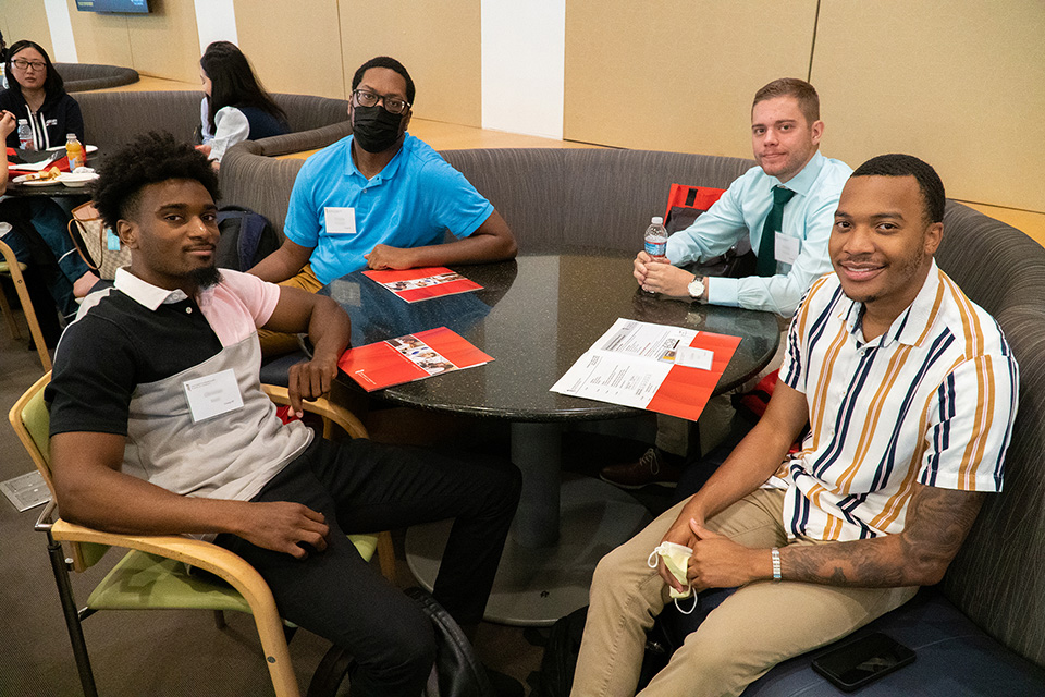 Four students get to know each other at PharmD orientation.