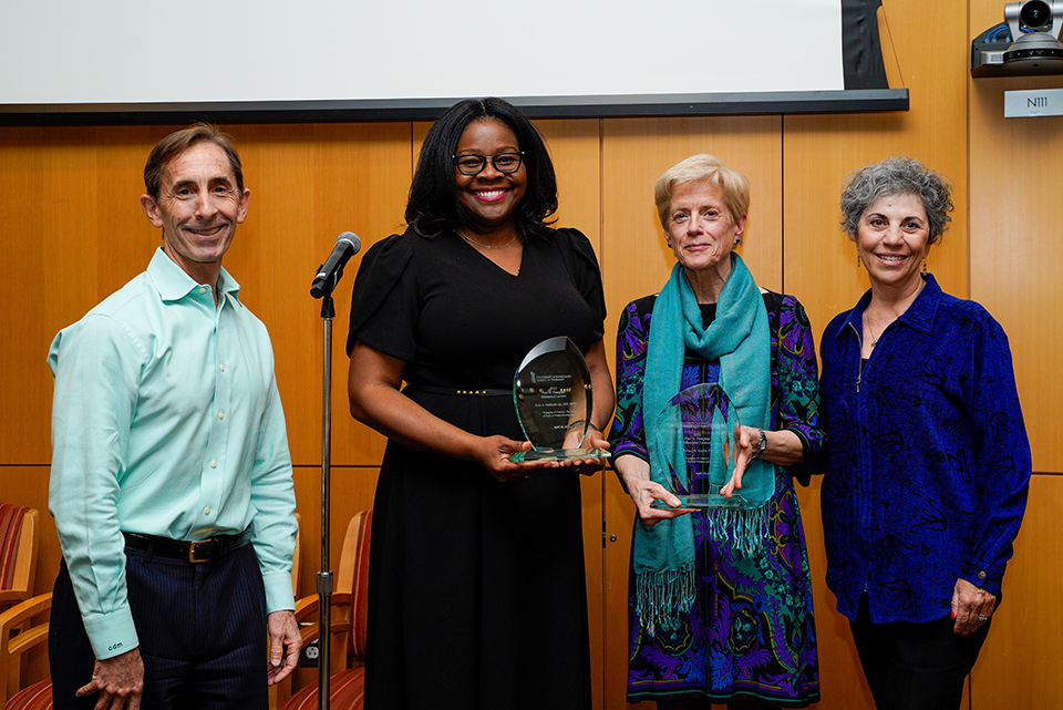 Professors Daniel Mullins and Eleanor Perfetto stand with the 2023 Pumpian Lecture speakers, Lola Fashoyin-Aje and Theresa Mullin.