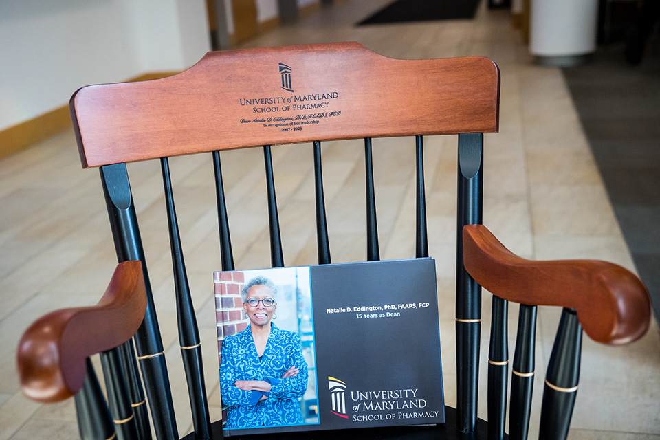 An engraved chair and tribute book for Natalie Eddington.