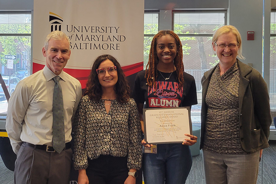 Aziza Frank receives an award alongside Phil Robilotto, Linda Petrillo, and Nancy Cowger.