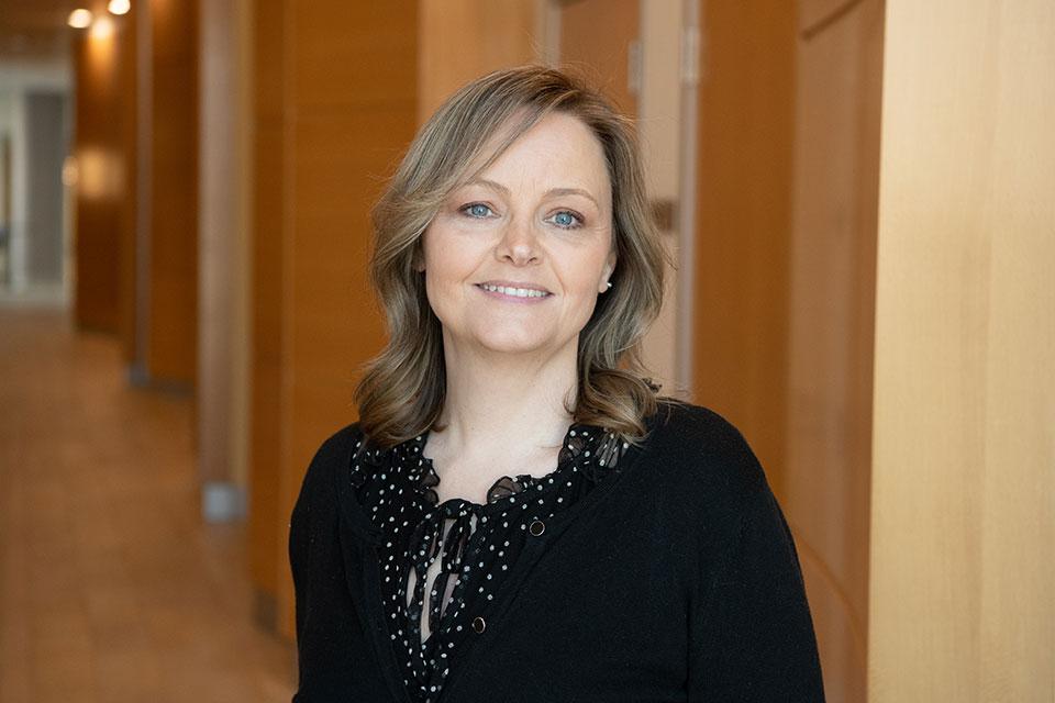 Headshot of Donna Dortch, wearing a black sweater and looking directly ahead