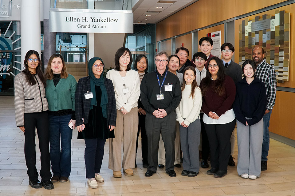 Group of student presenters and faculty from the Regulatory Science competition standing together in the Ellen H. Yankellow Grand Atrium in Pharmacy Hall